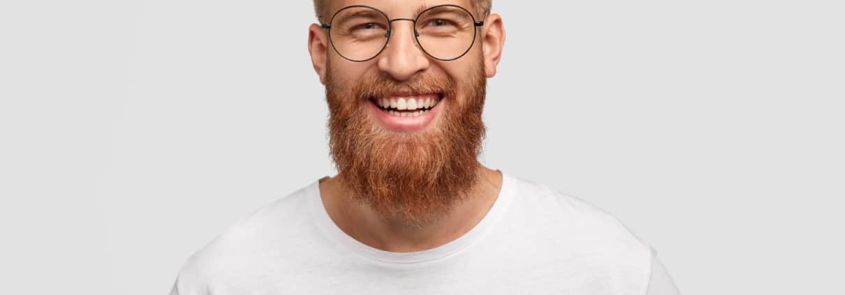 happy-man-with-long-thick-ginger-beard-has-friendly-smile